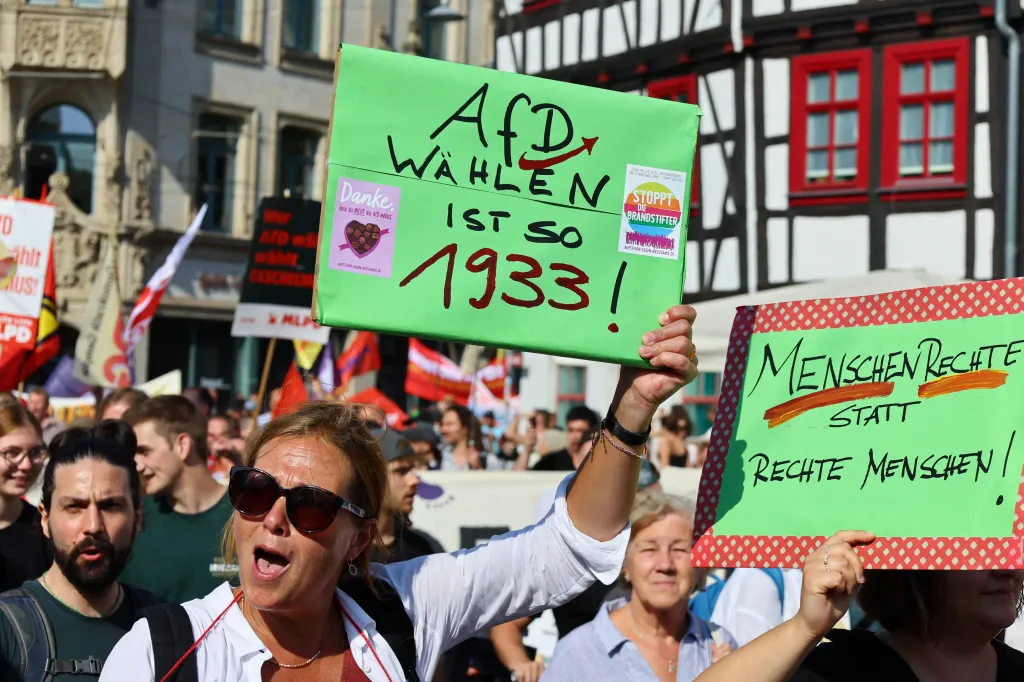 People hold placards during a protest against Germany's Alternative for Germany (AfD) party ahead of the Thuringia state elections, in Erfurt, Germany August 31, 2024. REUTERS/Wolfgang Rattay