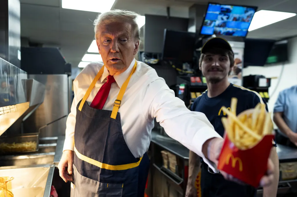 FEASTERVILLE-TREVOSE, PENNSYLVANIA - OCTOBER 20: Republican presidential nominee, former U.S. President Donald Trump works behind the counter during a campaign event at McDonald's restaurant on October 20, 2024 in Feasterville-Trevose, Pennsylvania. Trump is campaigning the entire day in the state of Pennsylvania. Trump and Democratic presidential nominee Vice President Kamala Harris continue to campaign in battleground swing states ahead of the November 5th election. (Photo by Doug Mills-Pool/Getty Images)