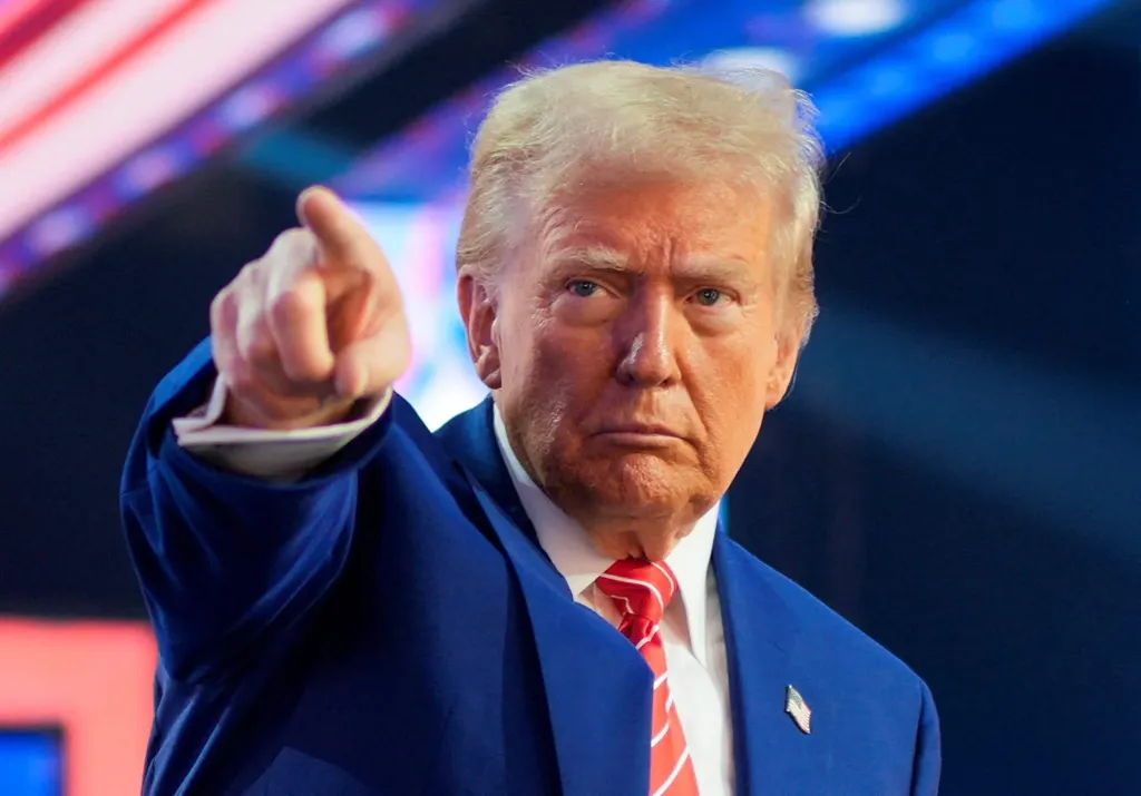 FILE PHOTO: U.S. President-elect Donald Trump gestures at Turning Point USA's AmericaFest in Phoenix, Arizona, U.S., December 22, 2024.  REUTERS/Cheney Orr/File Photo