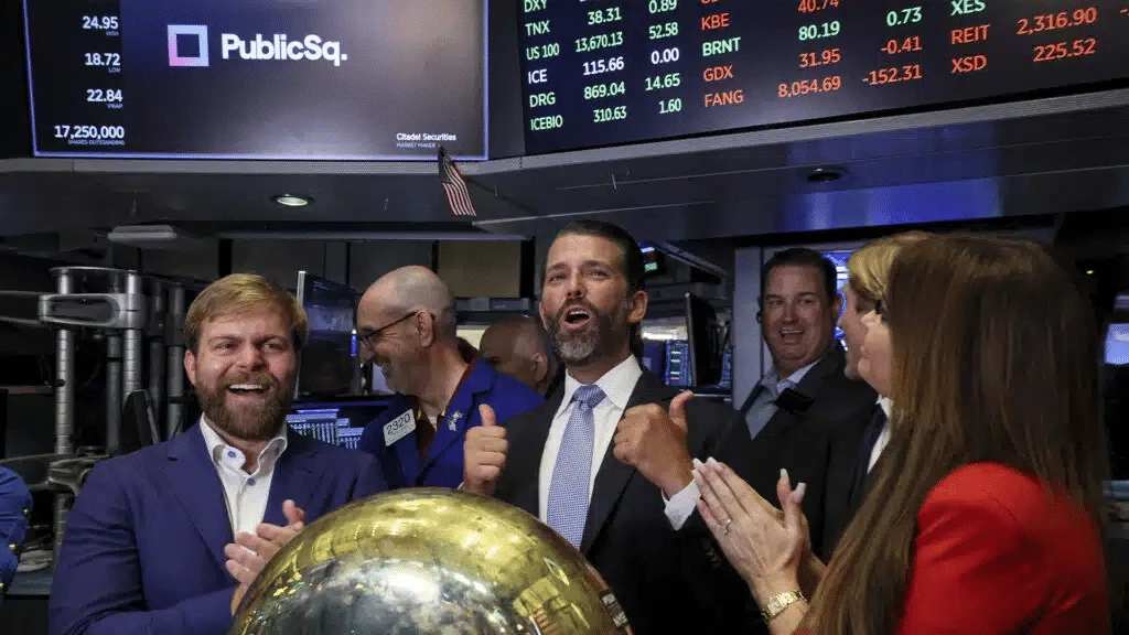 Michael Seifert (left) and Donald Trump Jr. (center) on PublicSquares first trading day / Photo: Reuters/Brendan McDermid